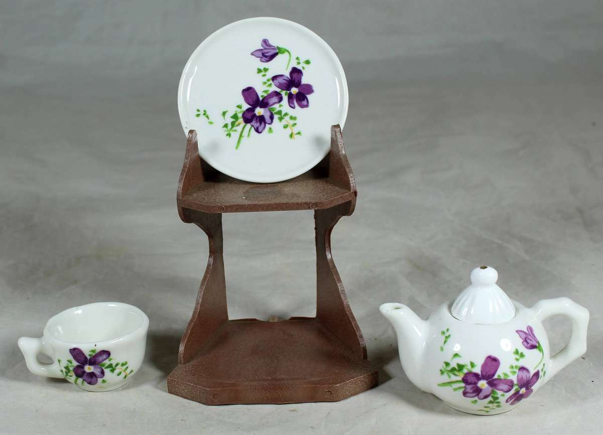Miniature tea for one - purple flowers on a stand