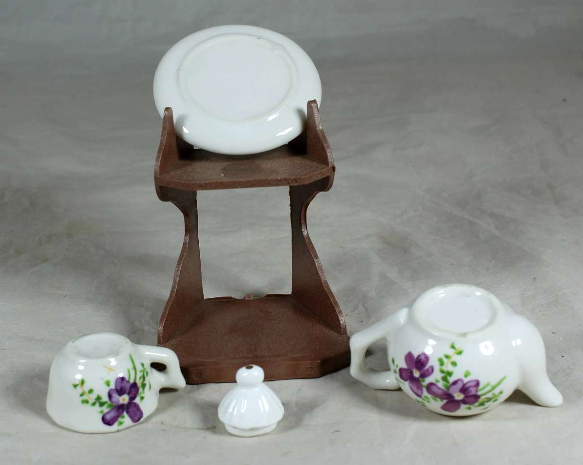 Miniature tea for one - purple flowers on a stand