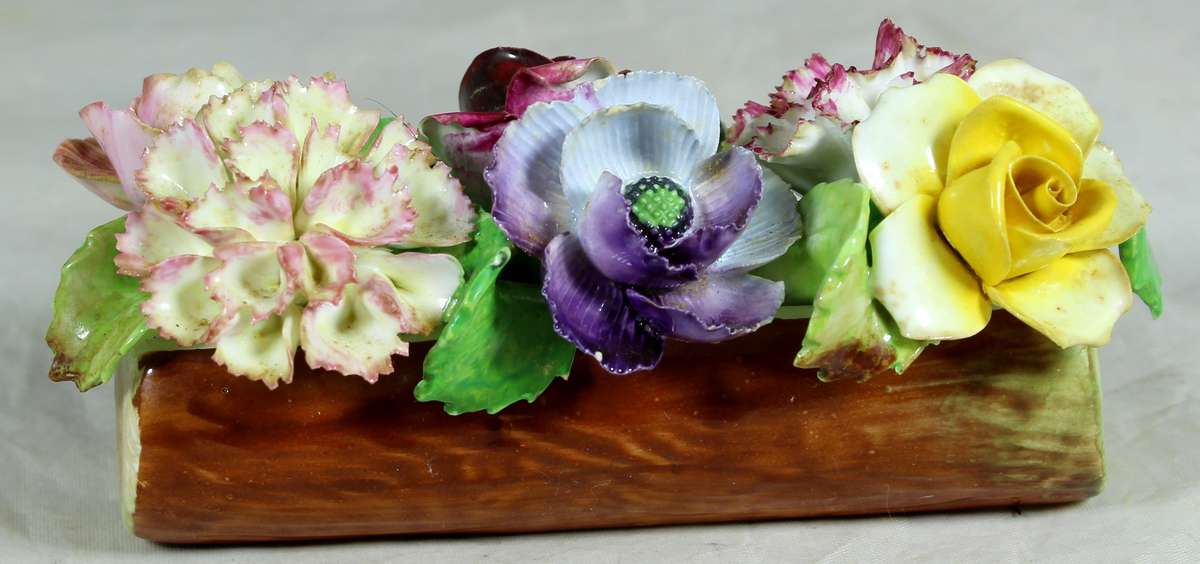 Posies in a log