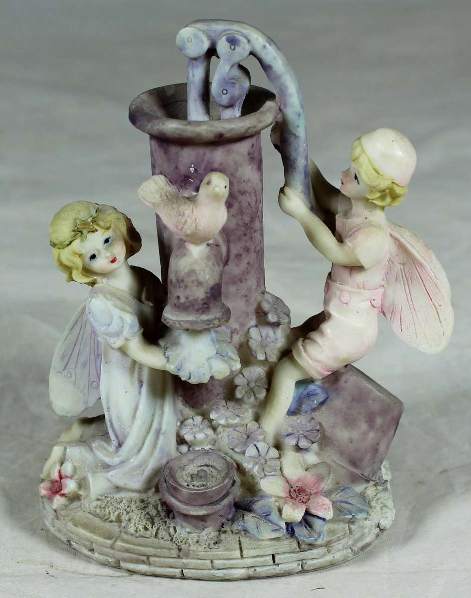 Angel and dove at the water pump