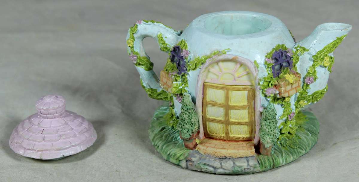 Resin small teapot with mice taking tea