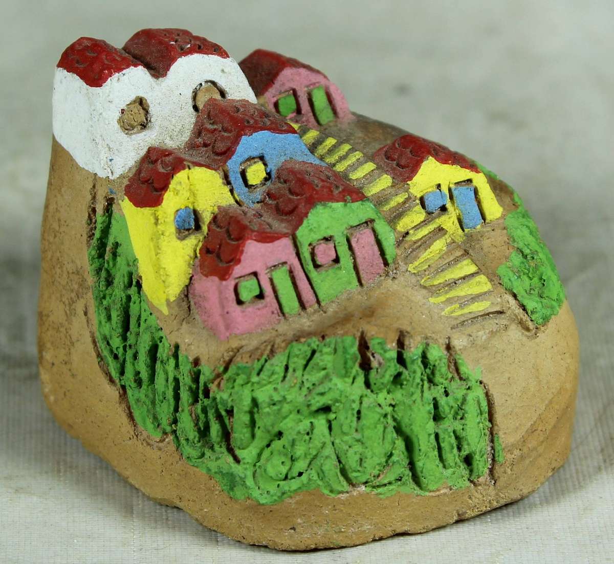 Miniature pottery house on the hillside