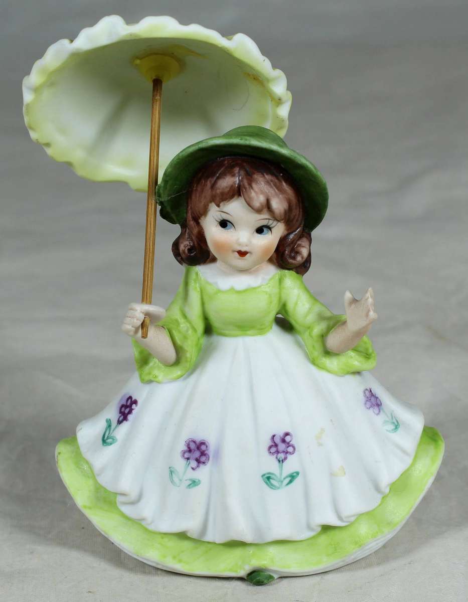 Ceramic country girl holding a parasol
