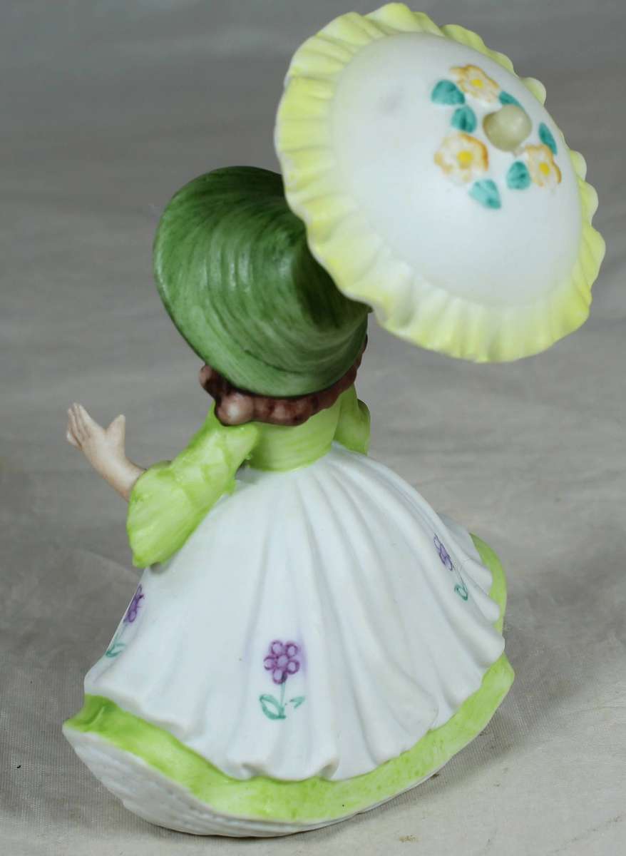 Ceramic country girl holding a parasol