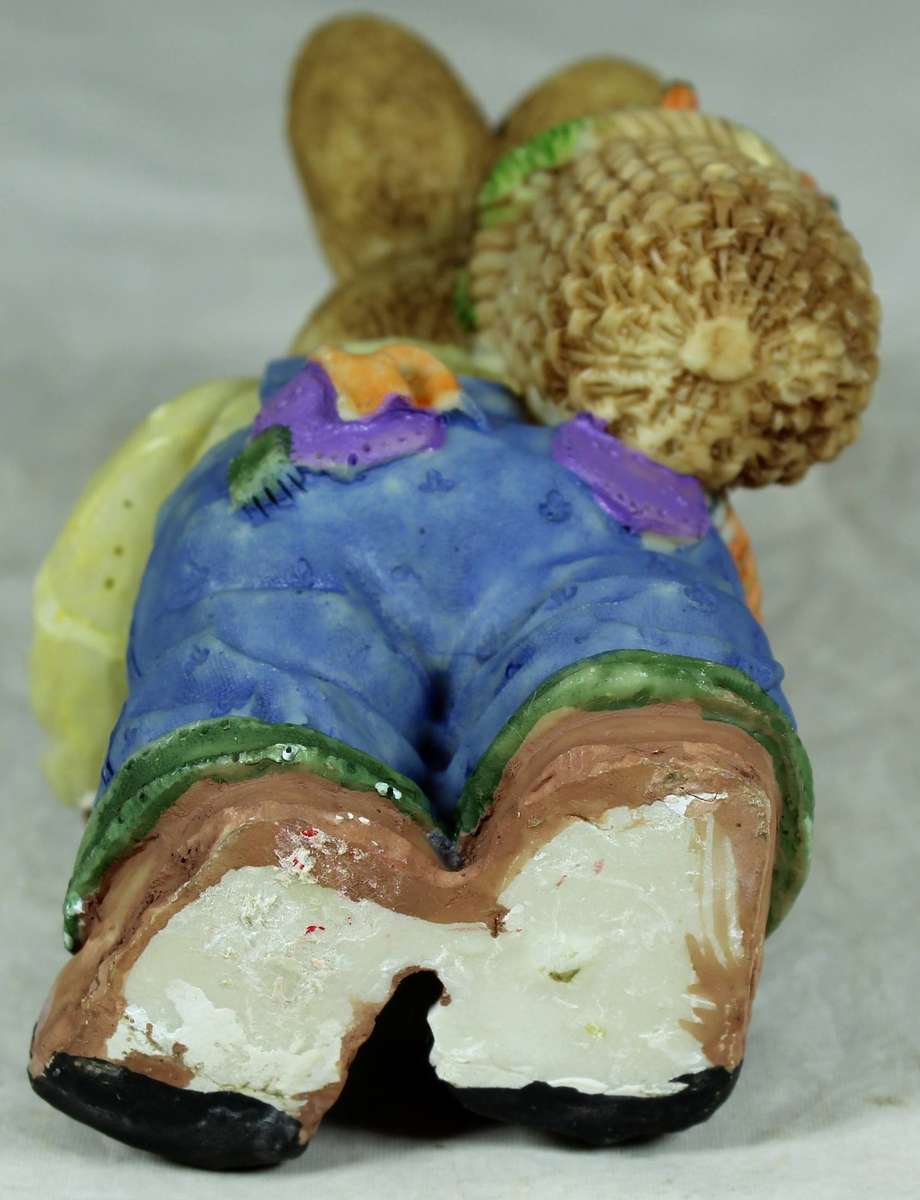 Resin rabbit with bushel of carrots