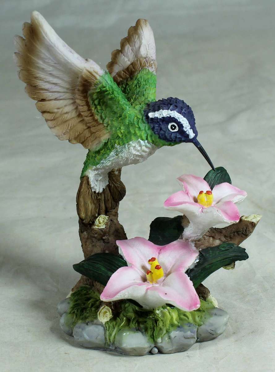 Molded hummingbird with pink flowers