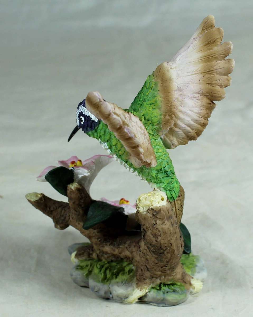 Molded hummingbird with pink flowers