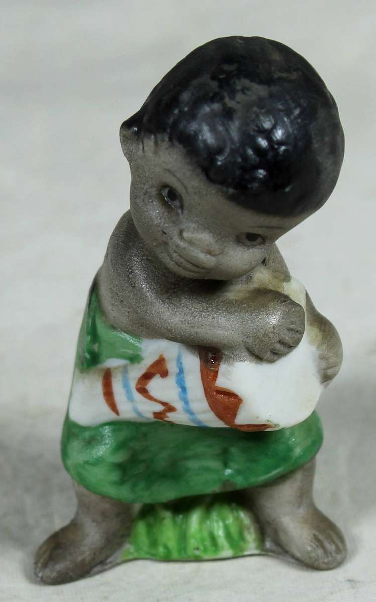 Ceramic figurine - Boy playing a drum