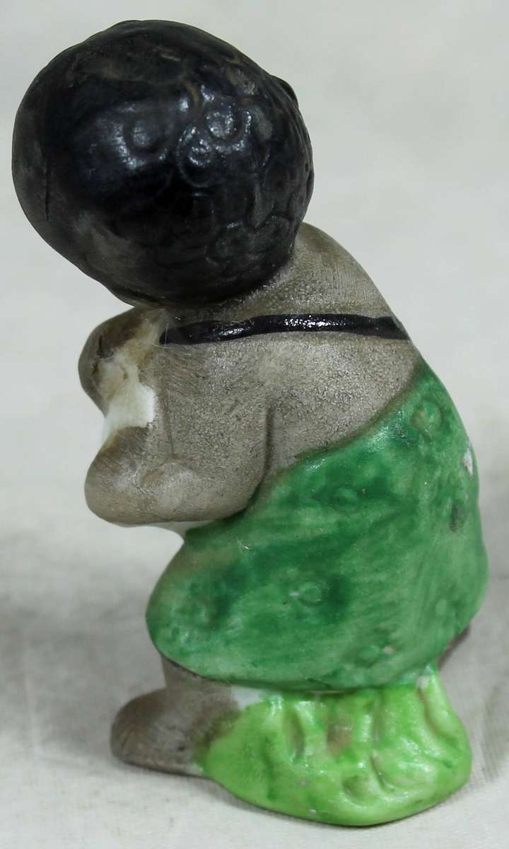 Ceramic figurine - Boy playing a drum