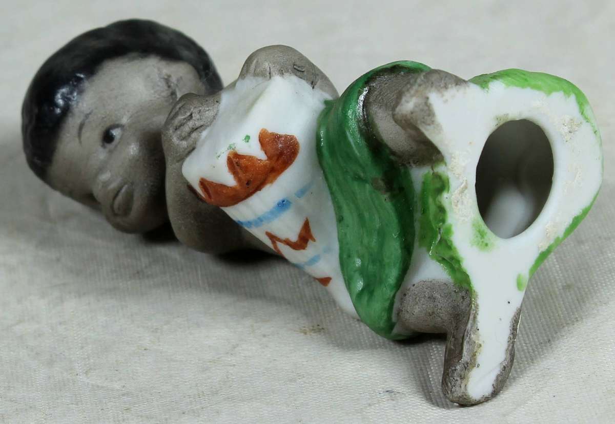 Ceramic figurine - Boy playing a drum
