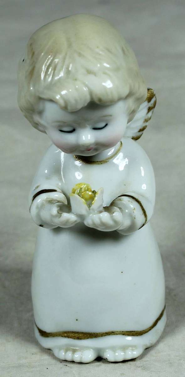Ceramic figurine - Baby angel holding a flower