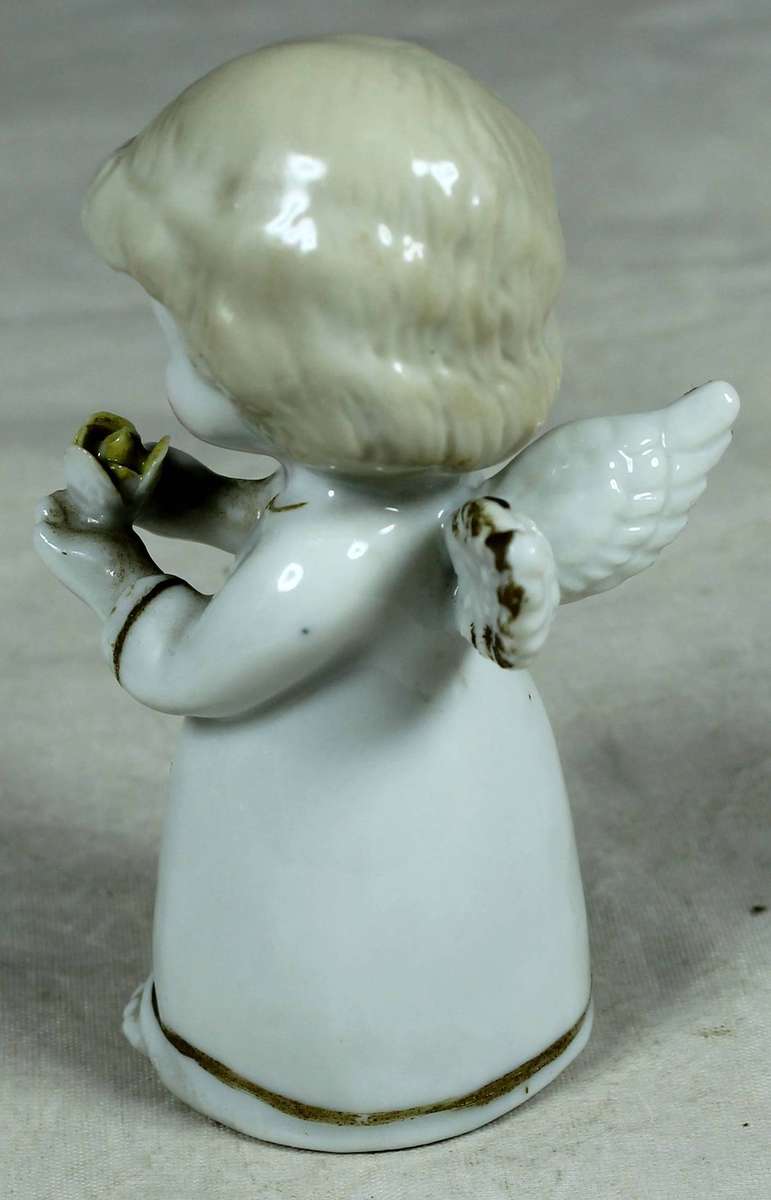 Ceramic figurine - Baby angel holding a flower