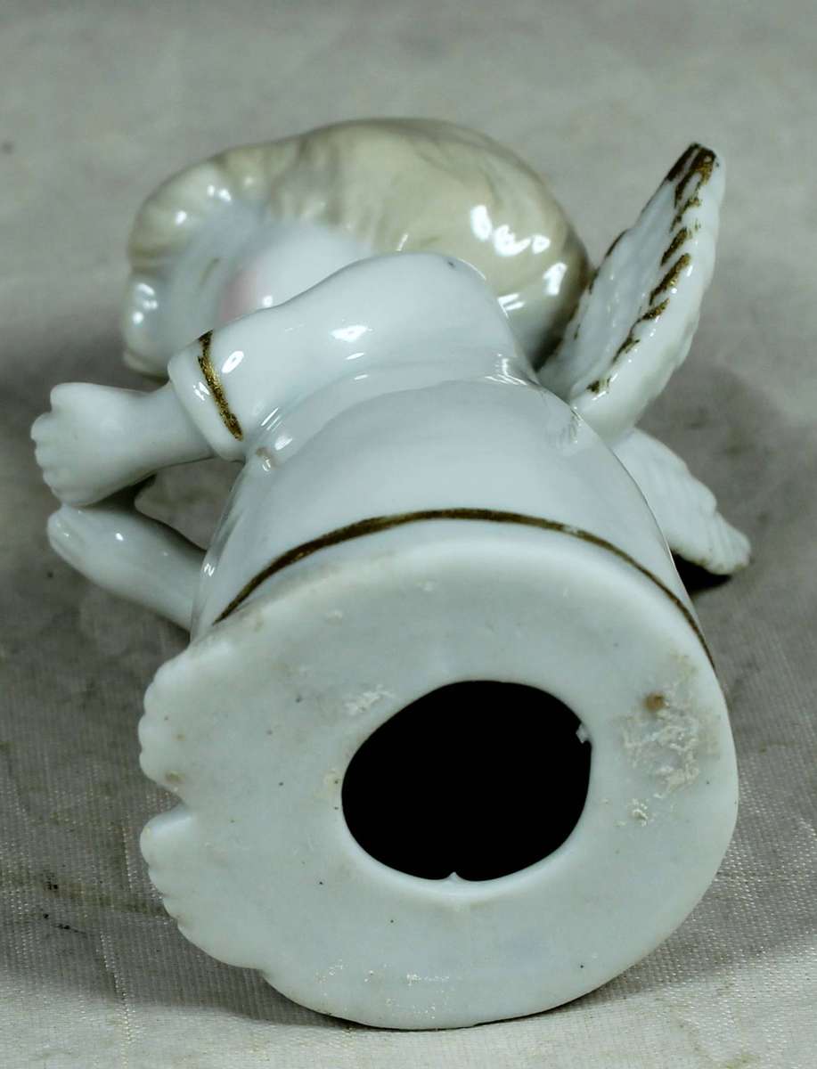 Ceramic figurine - Baby angel holding a flower