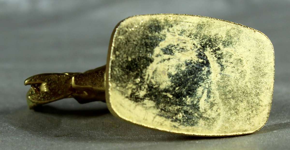 Miniature gold colored metal elephant