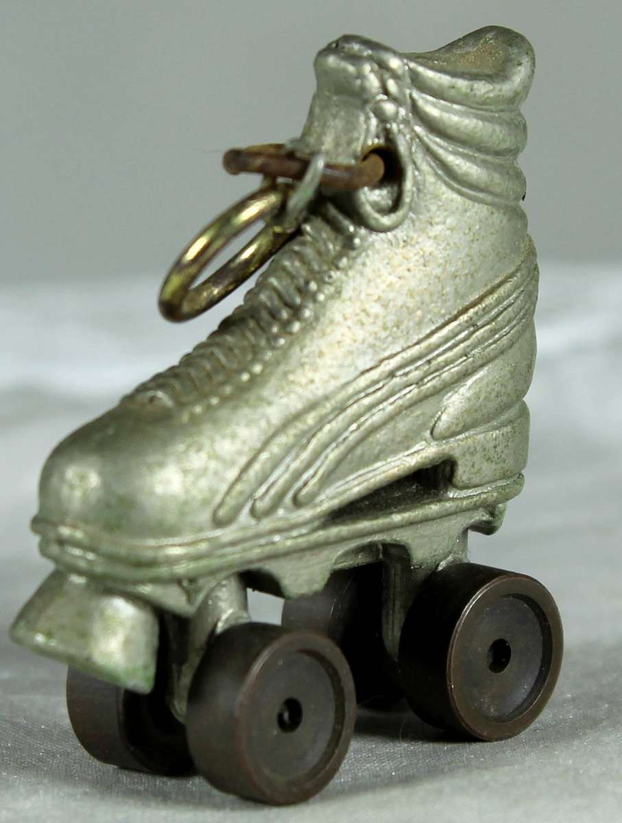 Miniature metal roller-skate