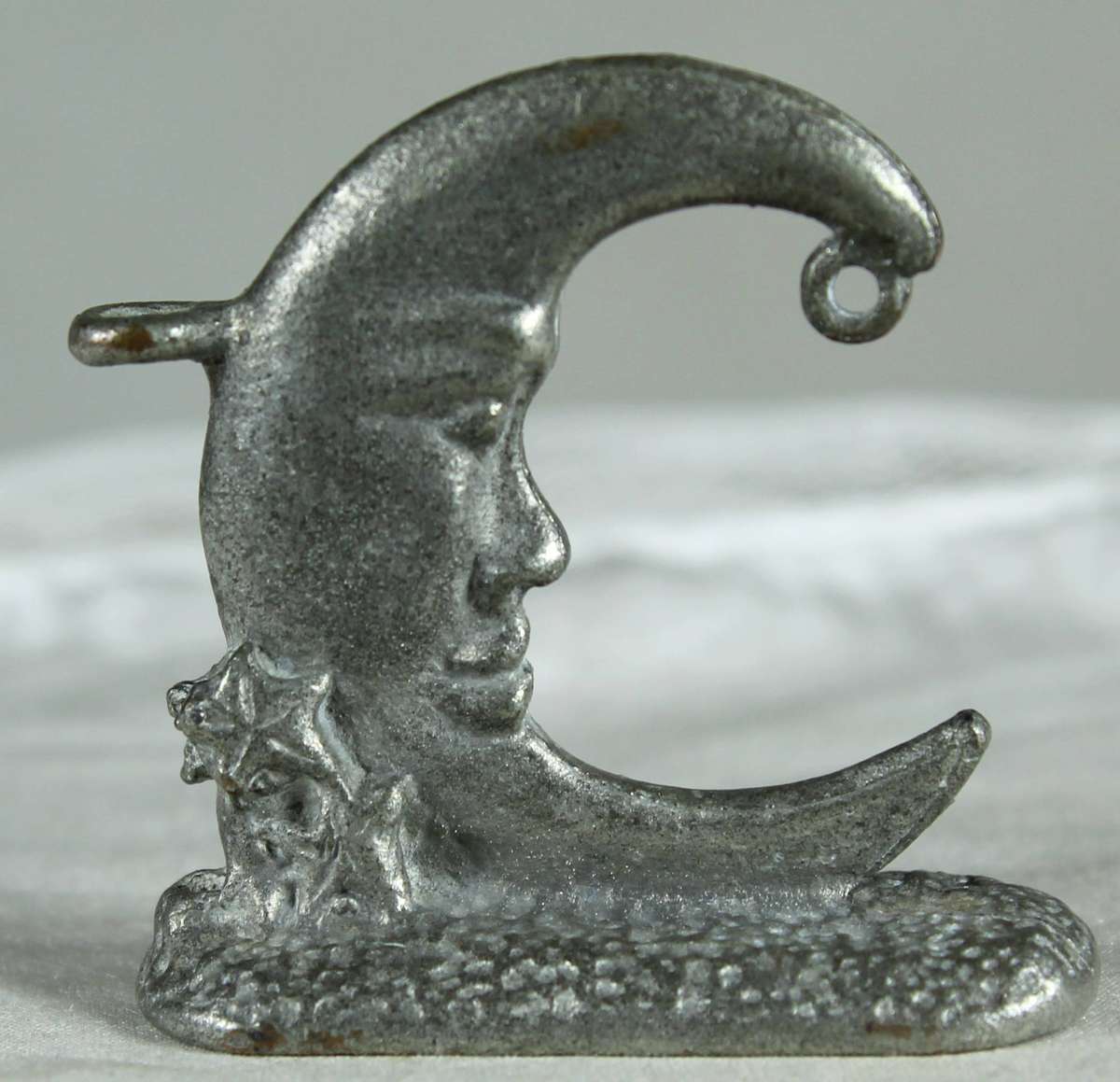Miniature metal man in the moon