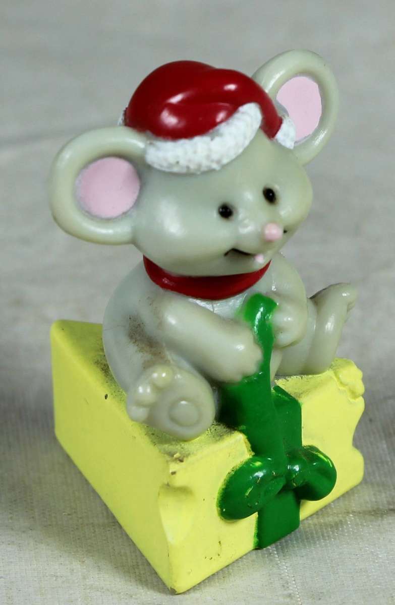 Miniature mouse sitting on a cheese - Russ