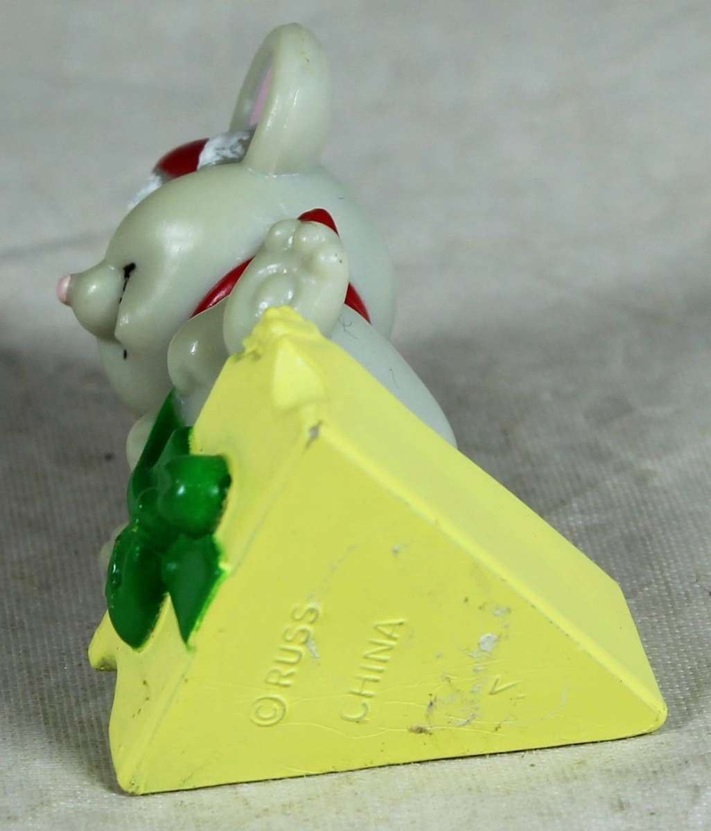 Miniature mouse sitting on a cheese - Russ