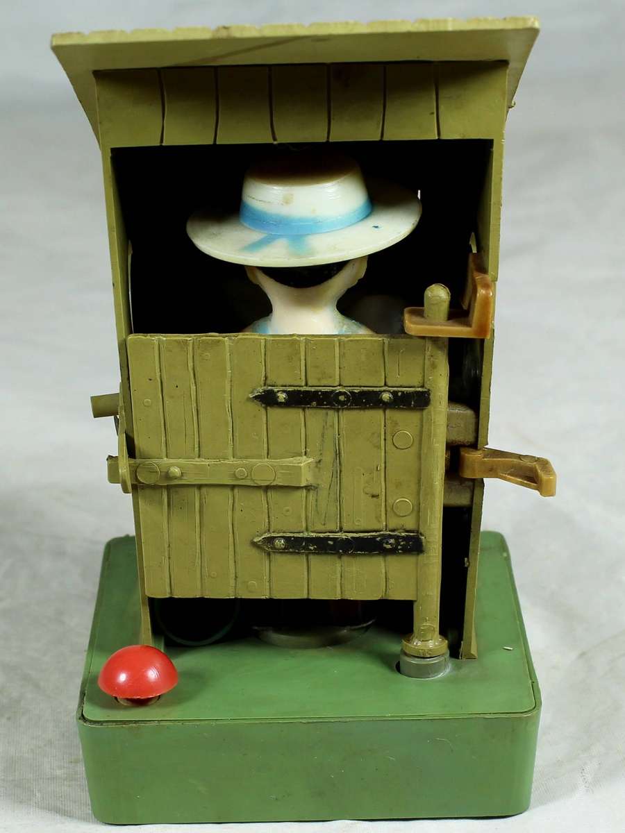 Vintage nowetty man in the outhouse