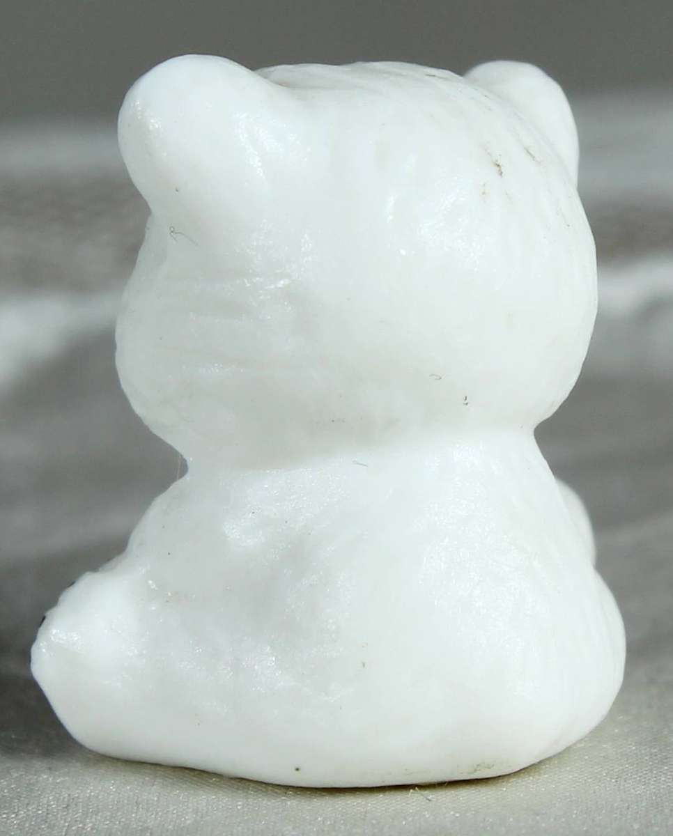Miniature bear baby seated