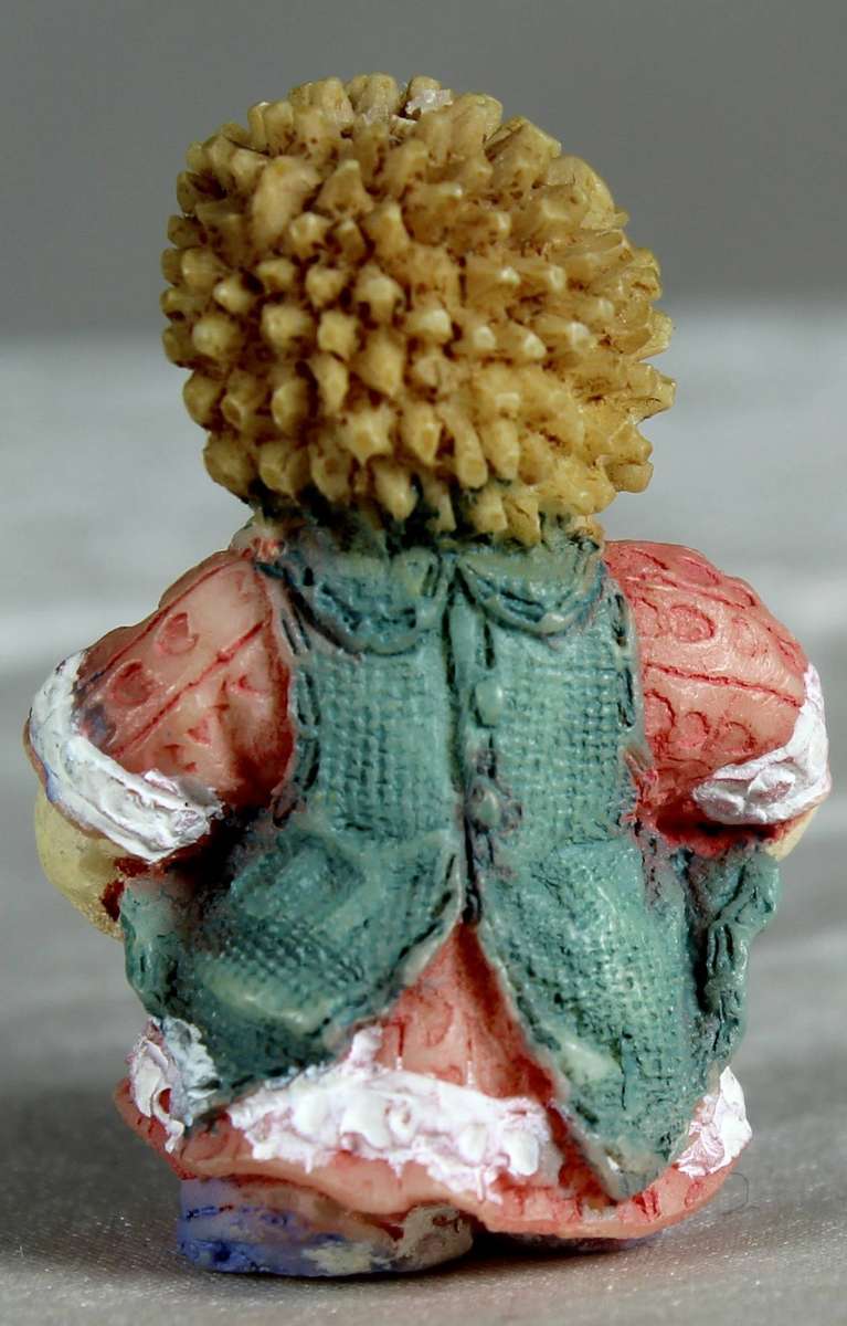 Mini miniature hedgehog carrying sweets in her apron