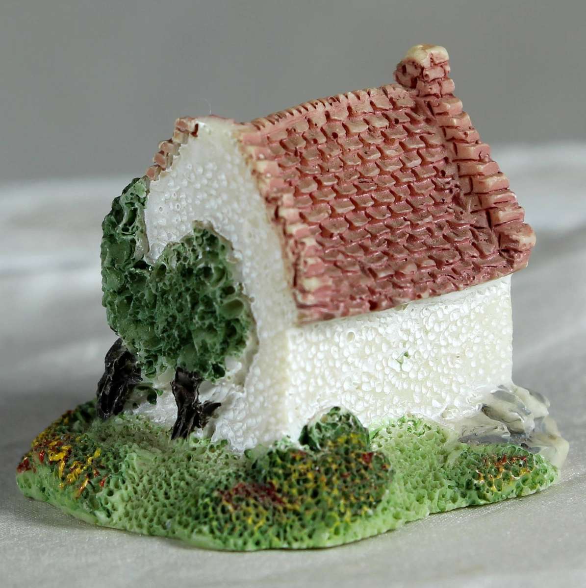 Miniature ceramic cottage with pitched roof
