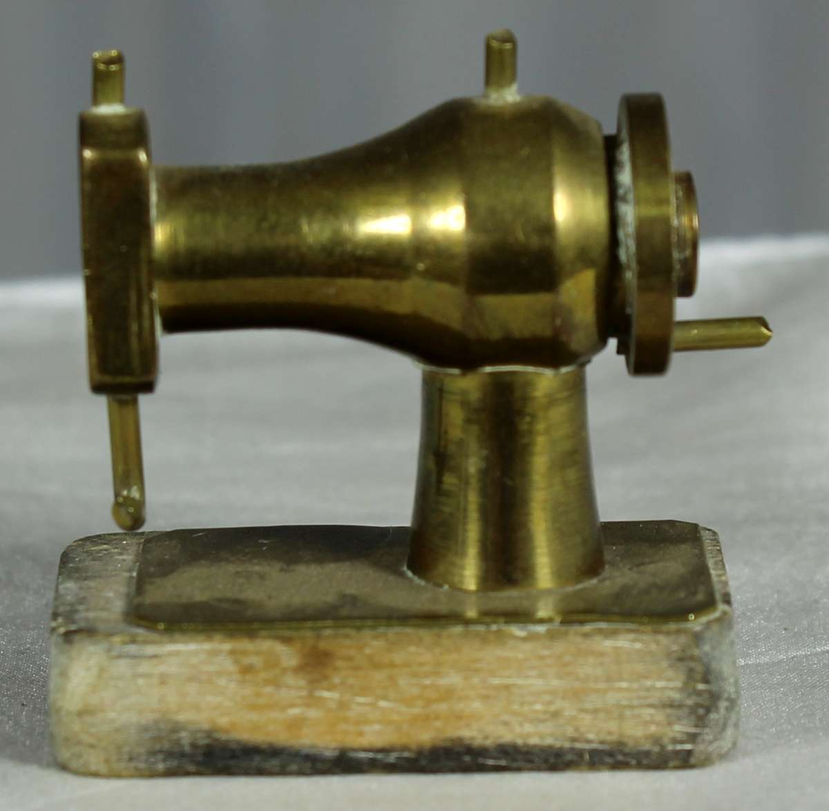 Vintage miniature brass sewing machine
