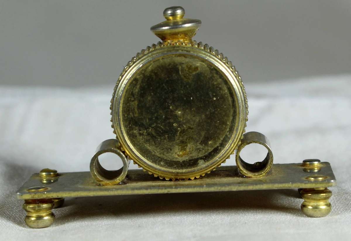 Miniature brass mantel clock