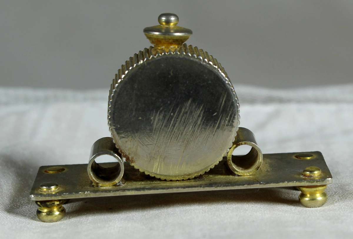 Miniature brass mantel clock