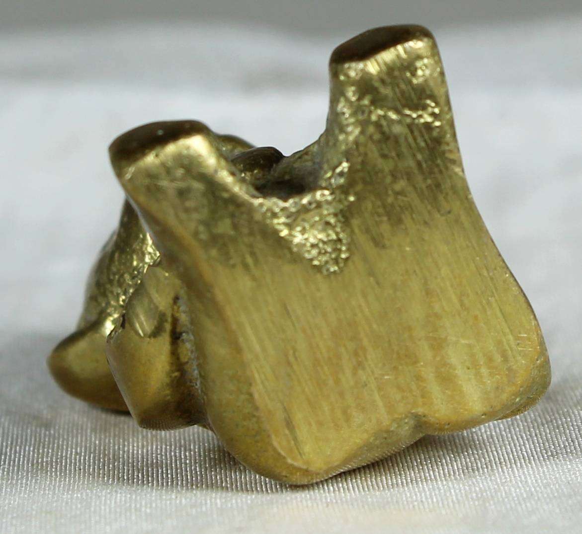Miniature brass teddy bear
