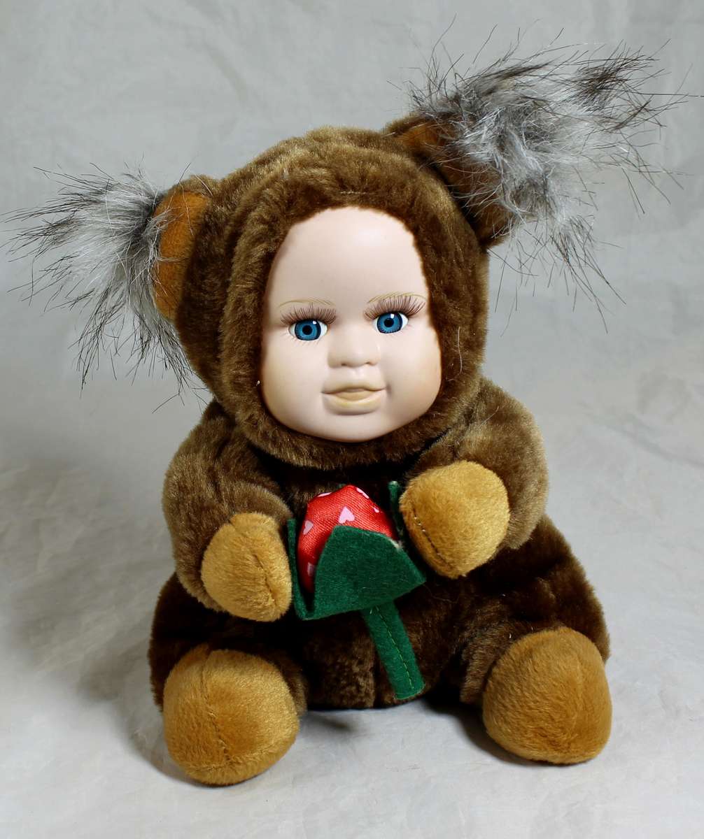 Collectors doll with blue eyes - porcelain face