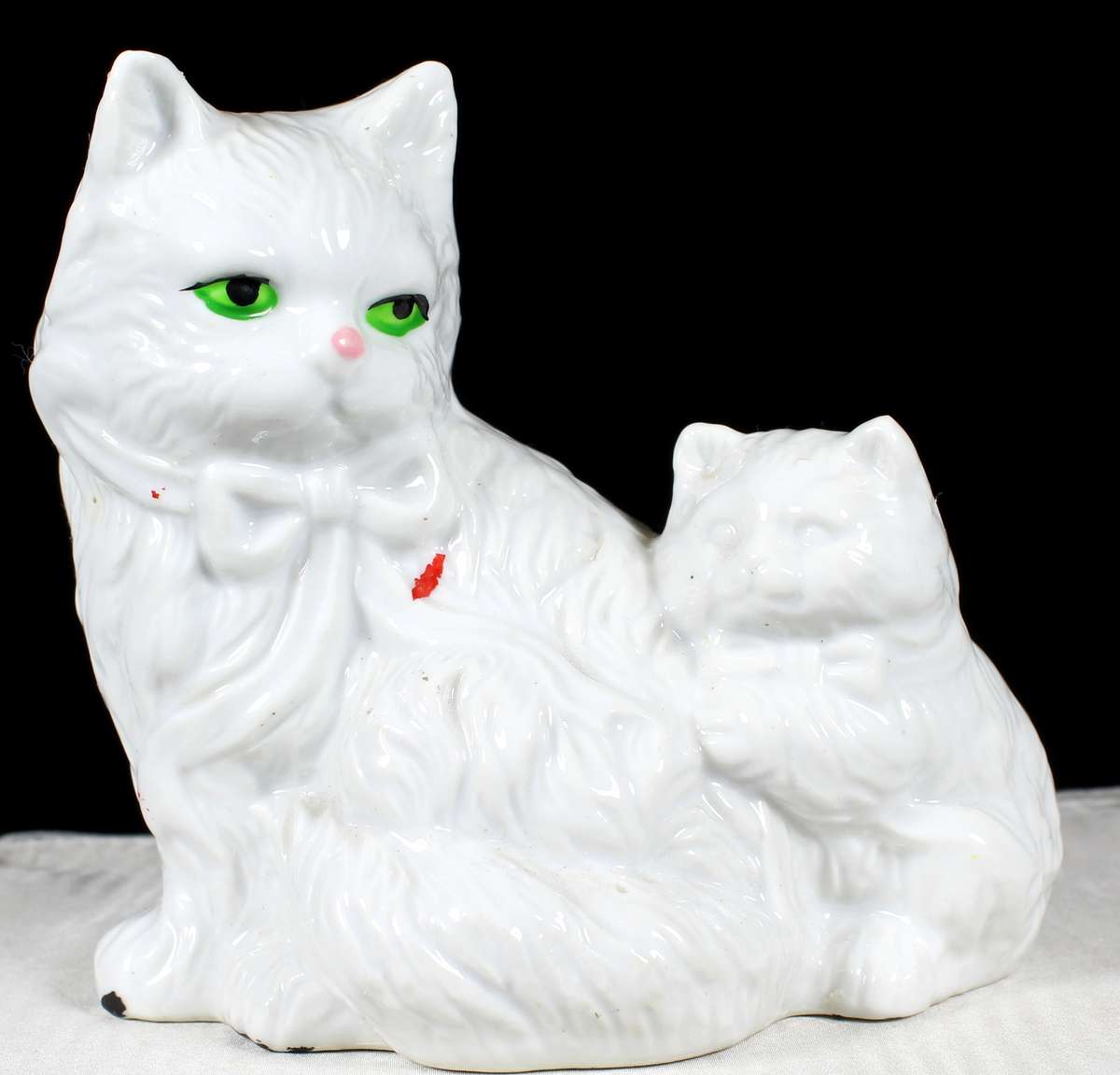 Porcelain cat with kitten money box