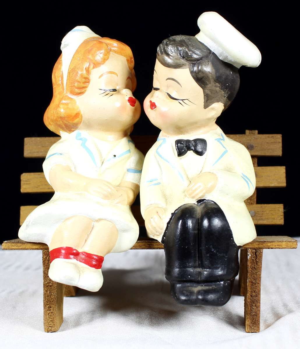 Kissing doctor and nurse on bench