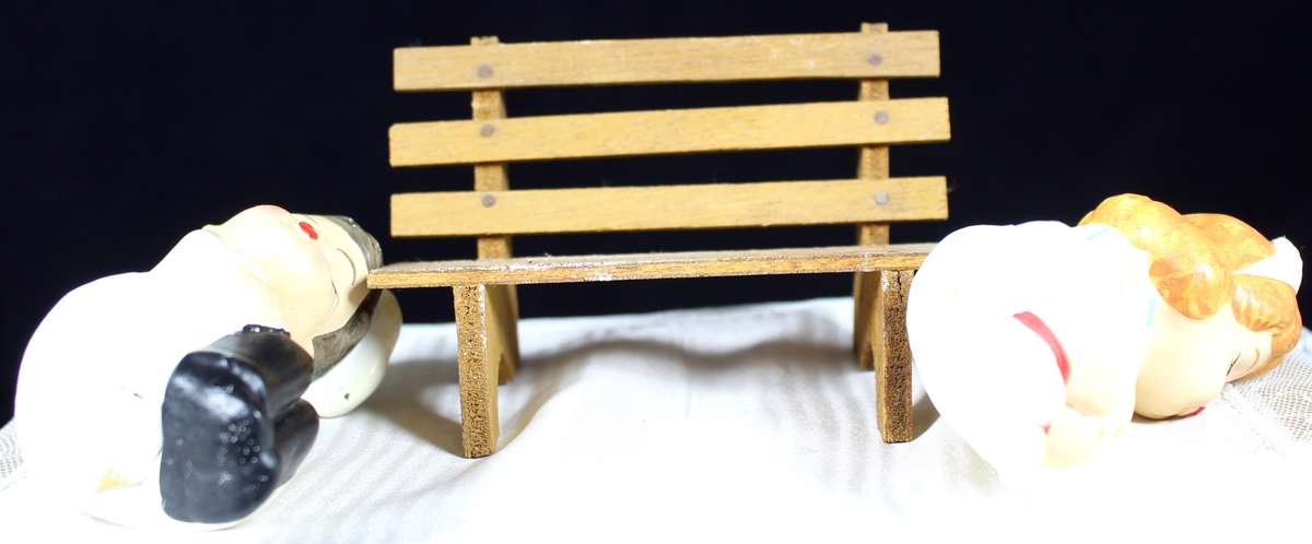 Kissing doctor and nurse on bench