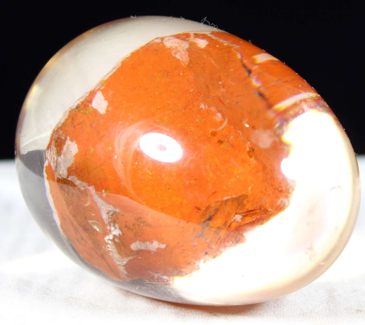 Glass egg paperweight with embedded semi precious stone