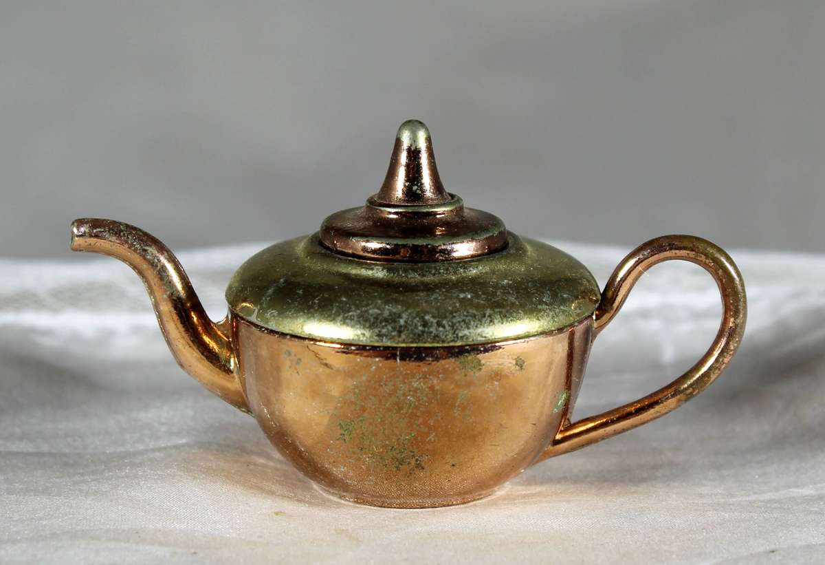 Miniature brass and copper teapot