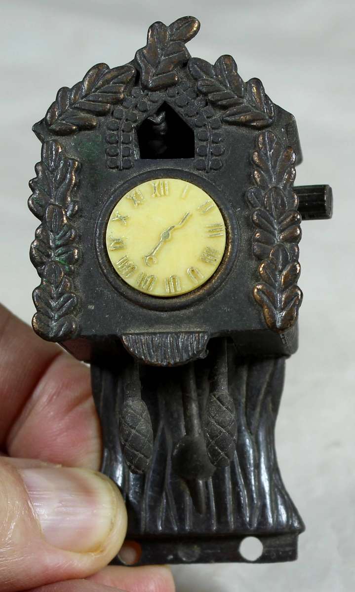 Metal miniature brass cucko clock with sharpener