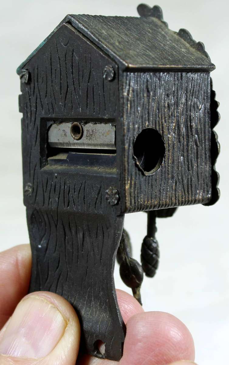Metal miniature brass cucko clock with sharpener