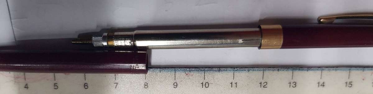 Vintage Sheaffer slim mechanical pencil in Plum colour with gold trim.