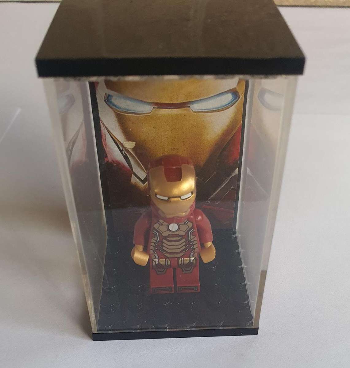 lego iron man figurine in lego box.