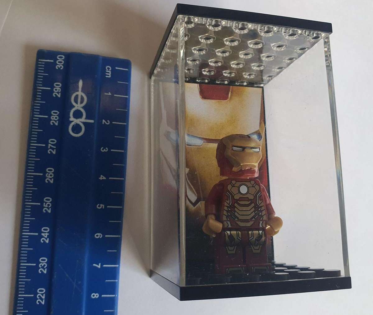 lego iron man figurine in lego box.