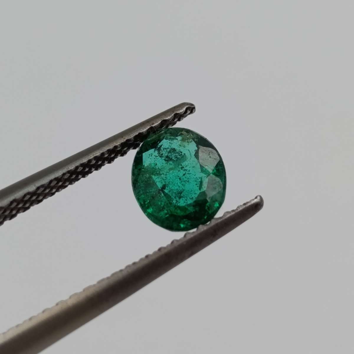 Natural Emerald of 0.68 carat oval mixed cut slight blueish green with Gemlab certificate