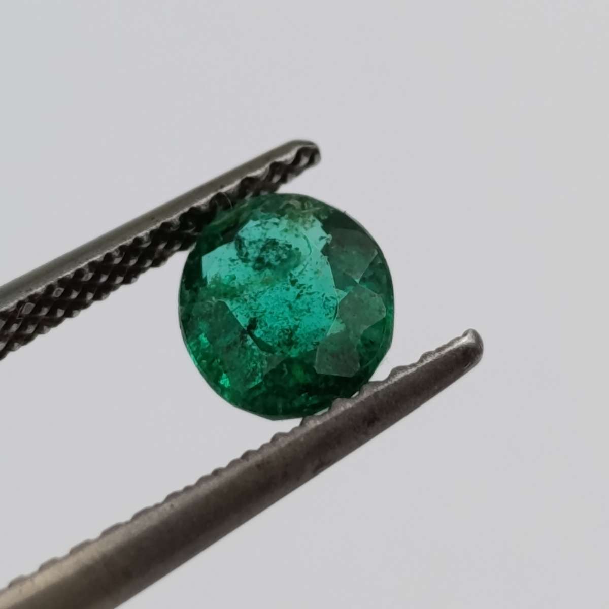 Natural Emerald of 0.68 carat oval mixed cut slight blueish green with Gemlab certificate