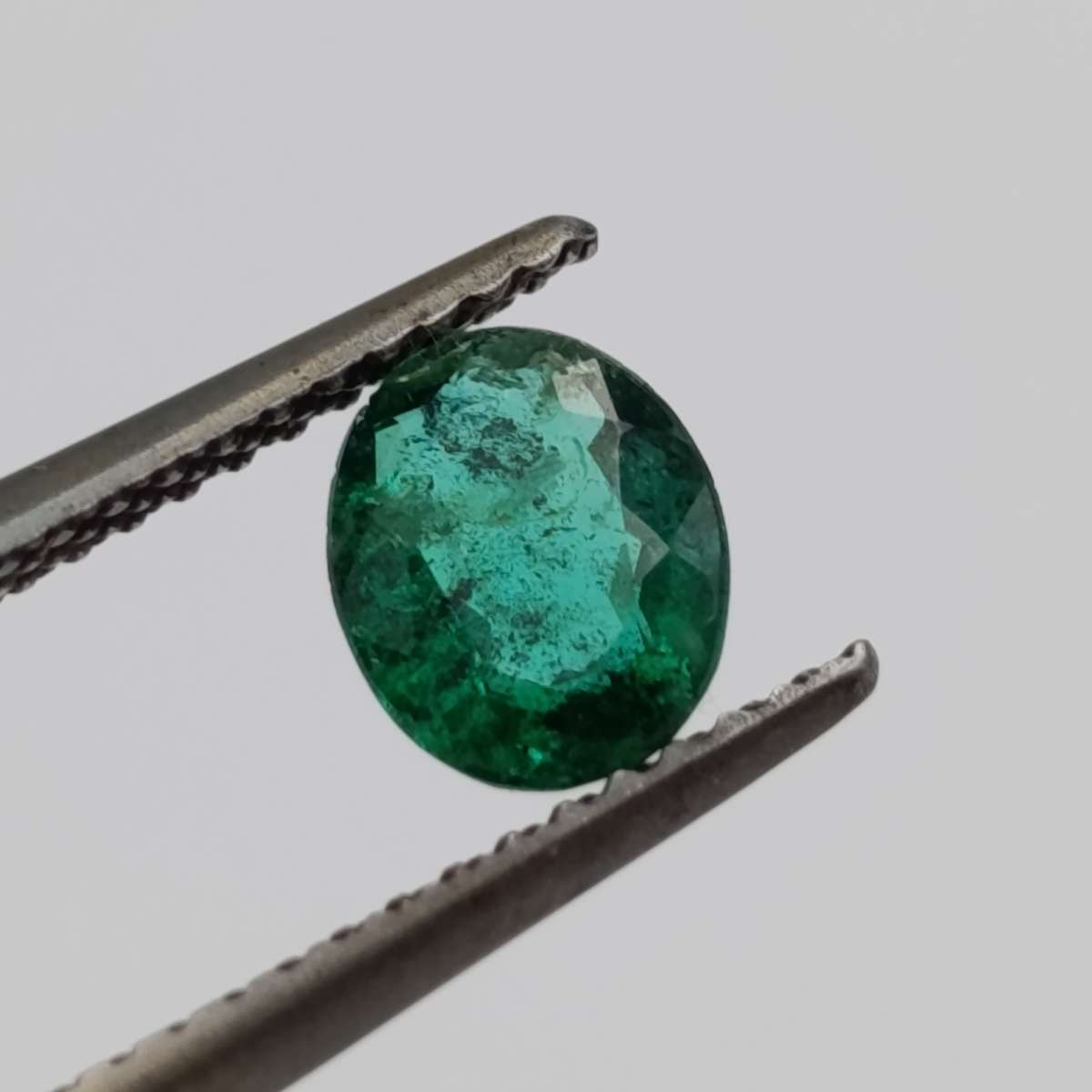 Natural Emerald of 0.68 carat oval mixed cut slight blueish green with Gemlab certificate