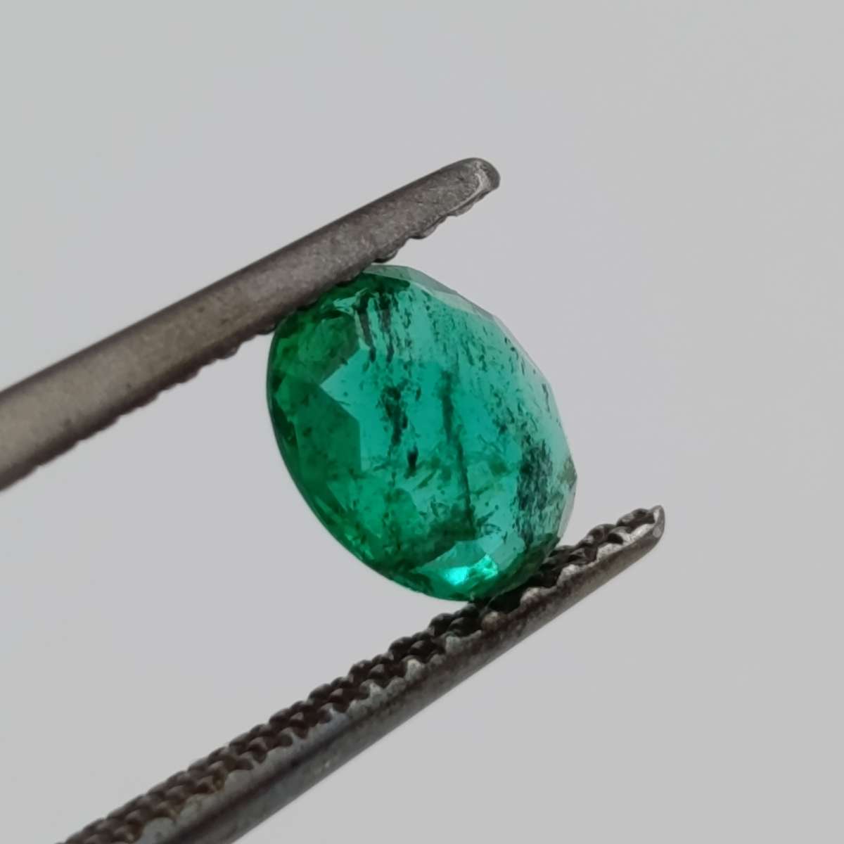 Natural Emerald of 0.68 carat oval mixed cut slight blueish green with Gemlab certificate