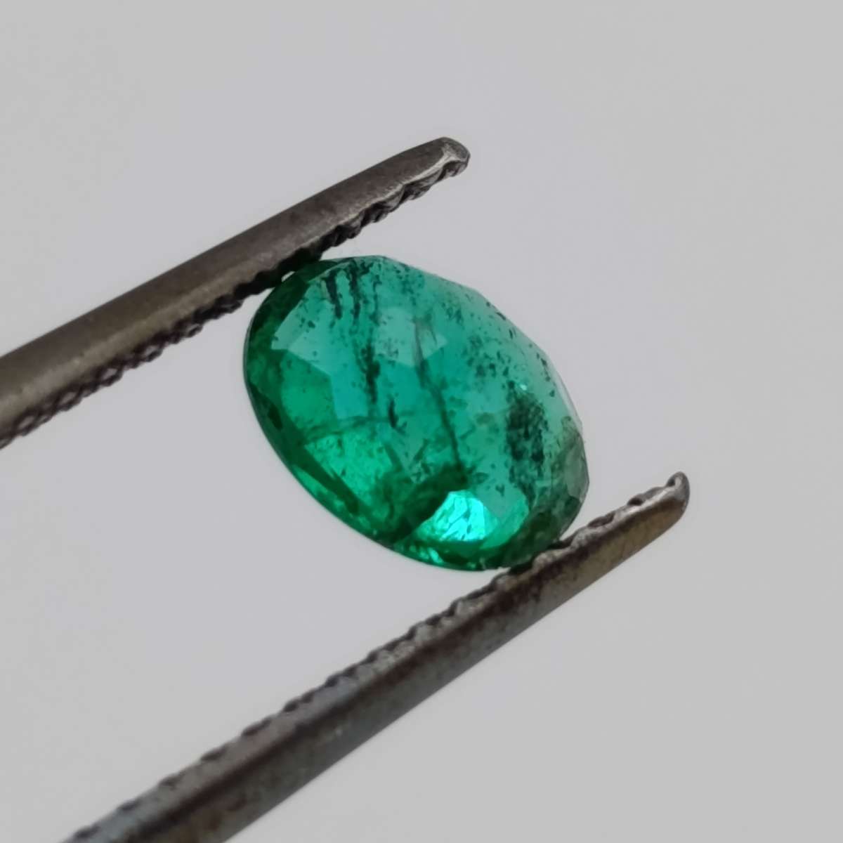 Natural Emerald of 0.68 carat oval mixed cut slight blueish green with Gemlab certificate