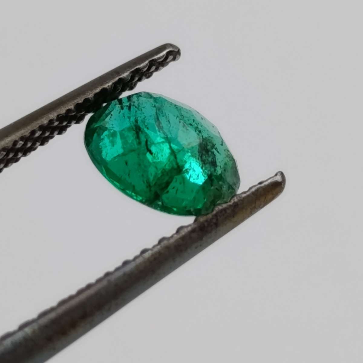 Natural Emerald of 0.68 carat oval mixed cut slight blueish green with Gemlab certificate