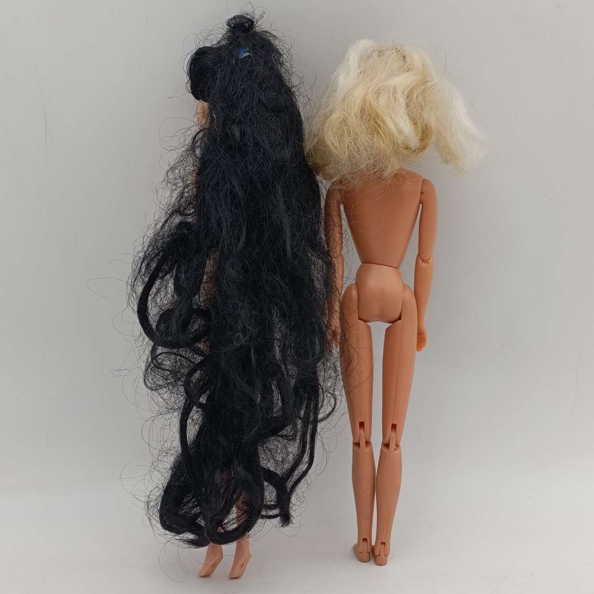 Two dolls with matted hair
