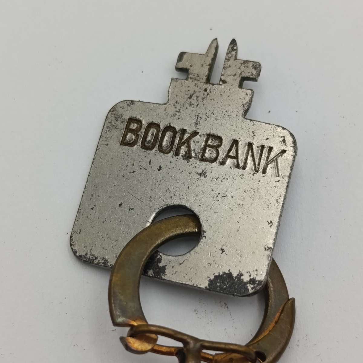 Vintage Nederlandsch-Indie postspaarbank book shaped money box with key