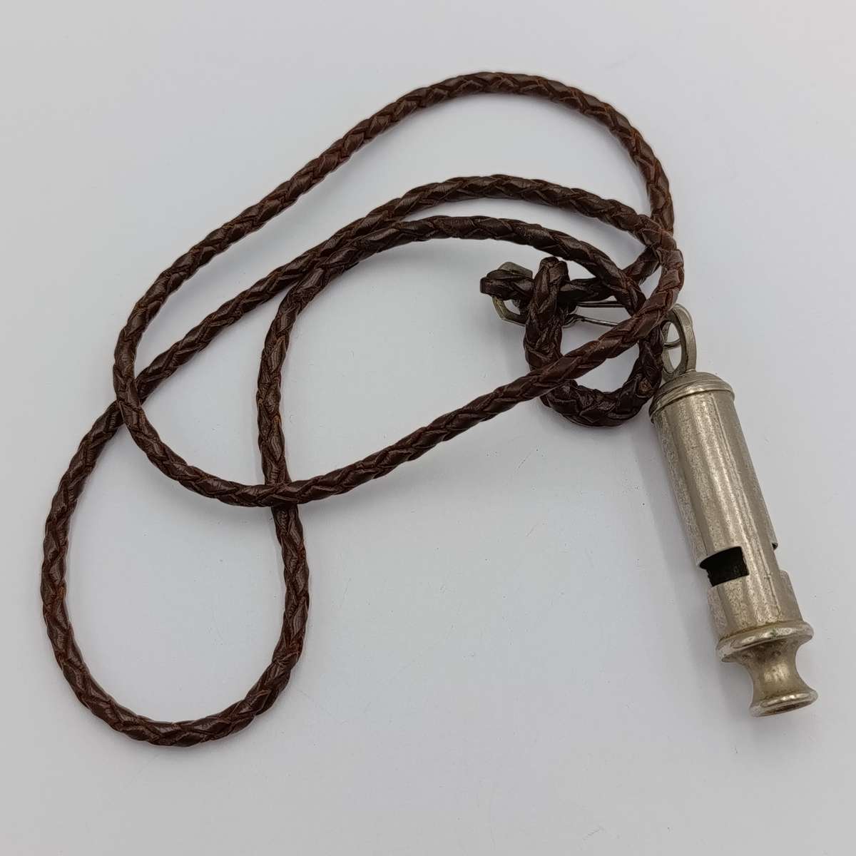 The ACME city police whistle with leather lanyard